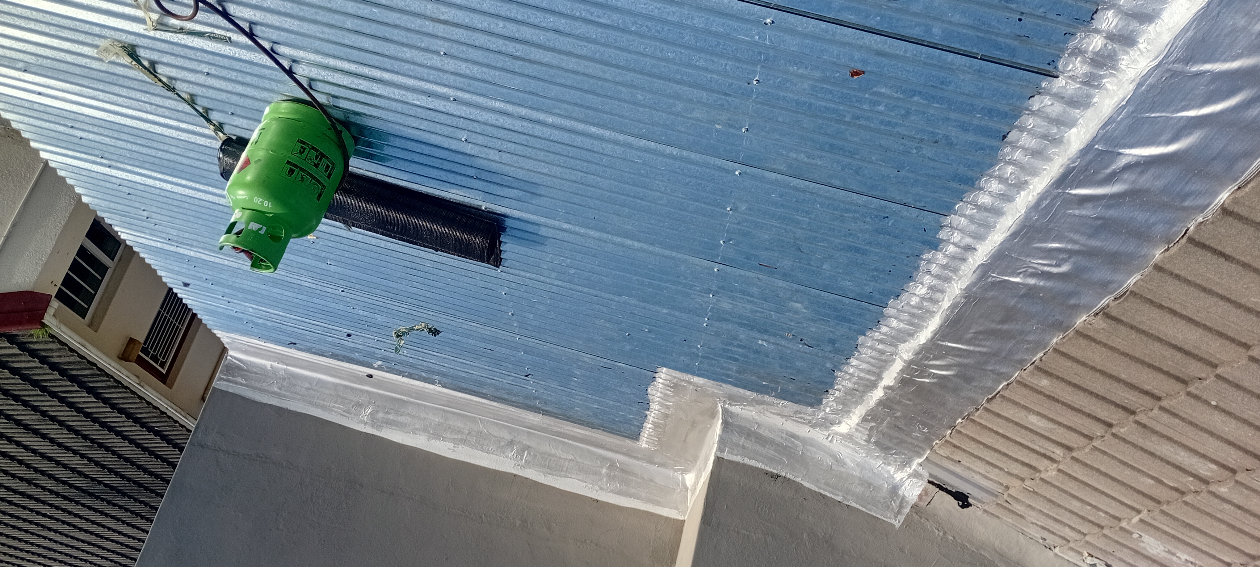 Waterproofed metal roof and parapet area