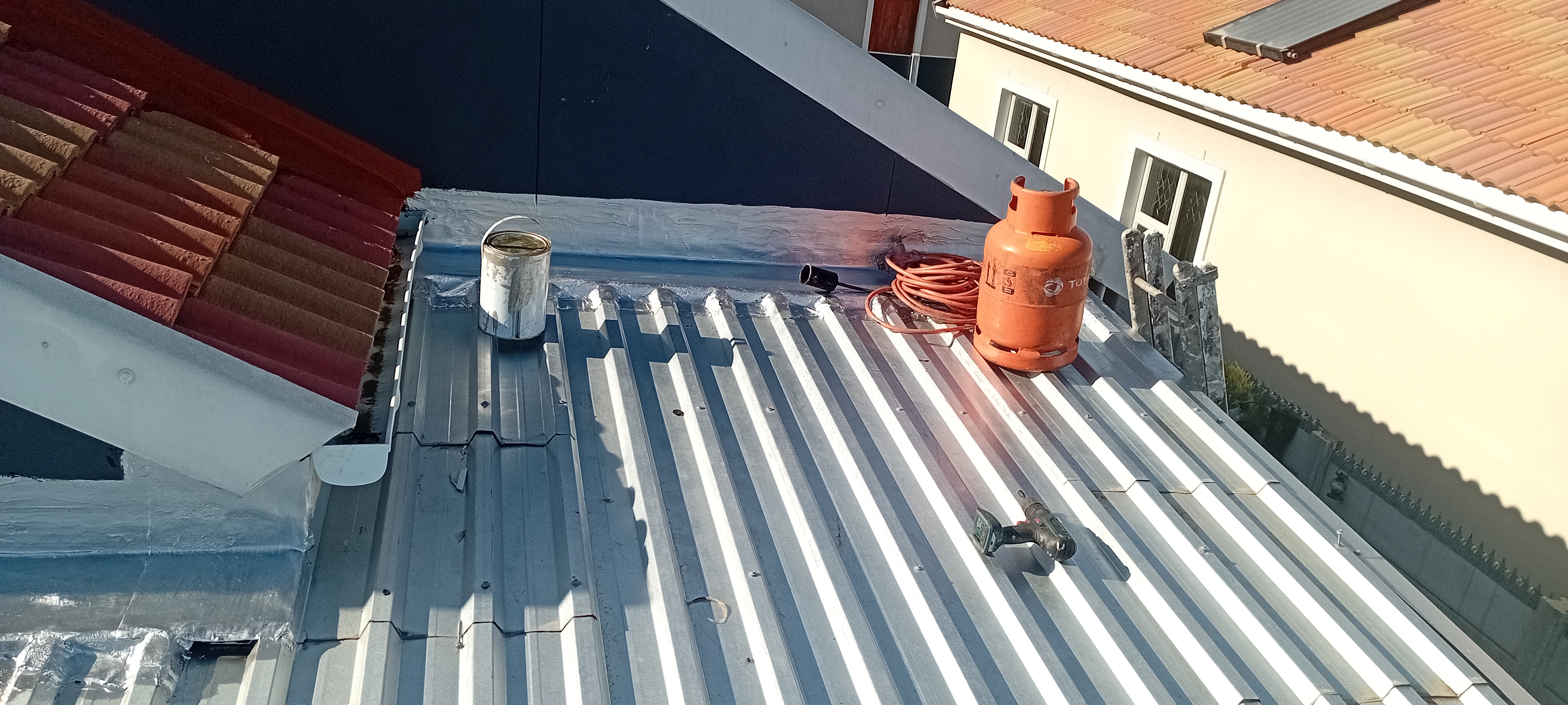 Completed roof finishing around a gable section