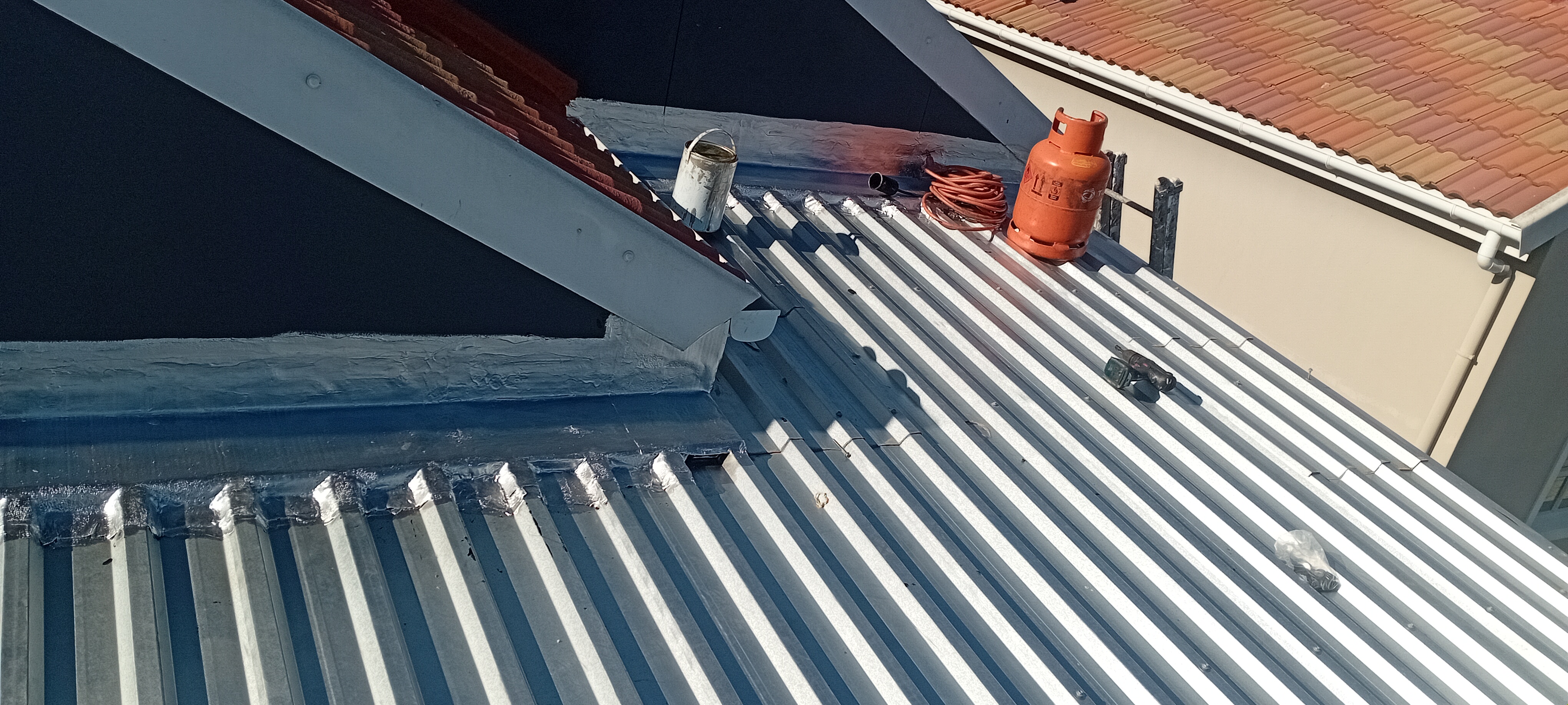 Wide view of completed roof flashing repair