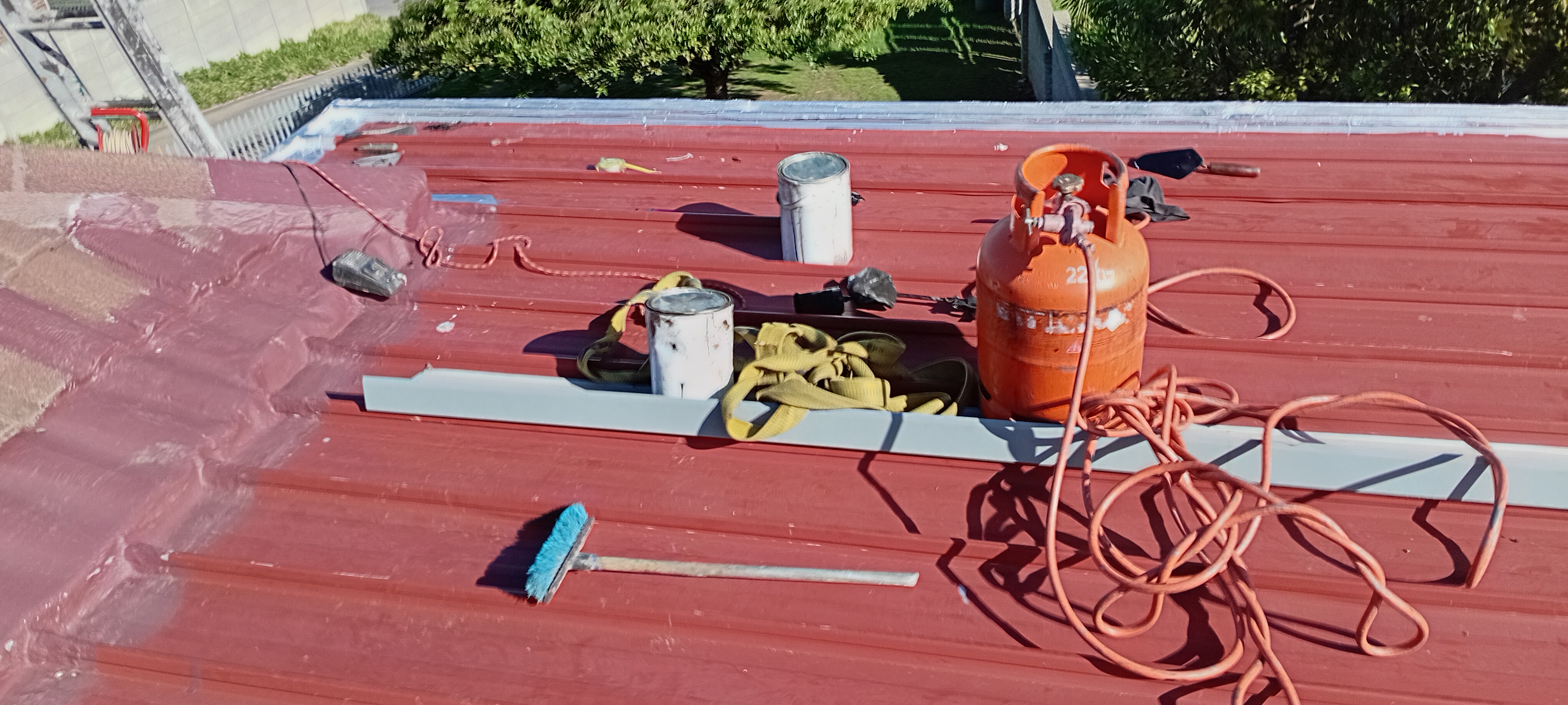 Red roof waterproofing detail after protective application